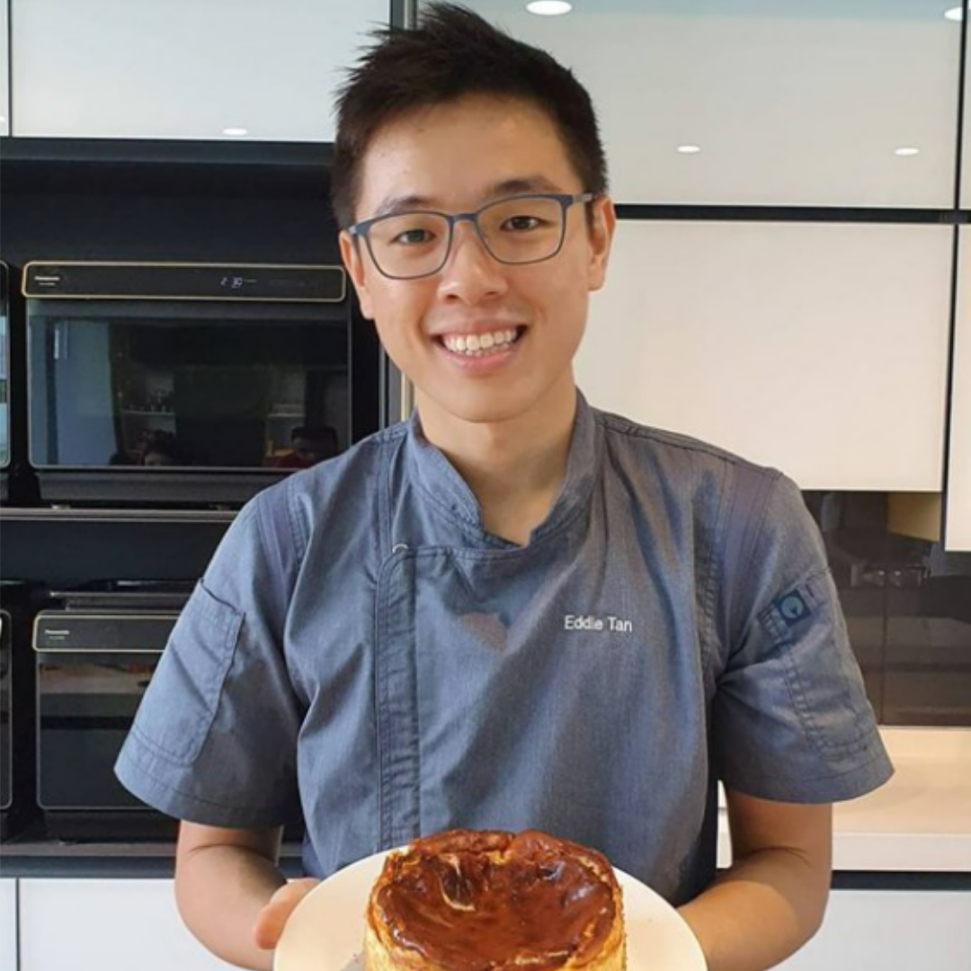 Eddie Tan, founder and owner of Caketella, holding a baked cake